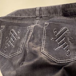 Express jeans . Lion Jeweled back pockets . Black/grey distressed wash .